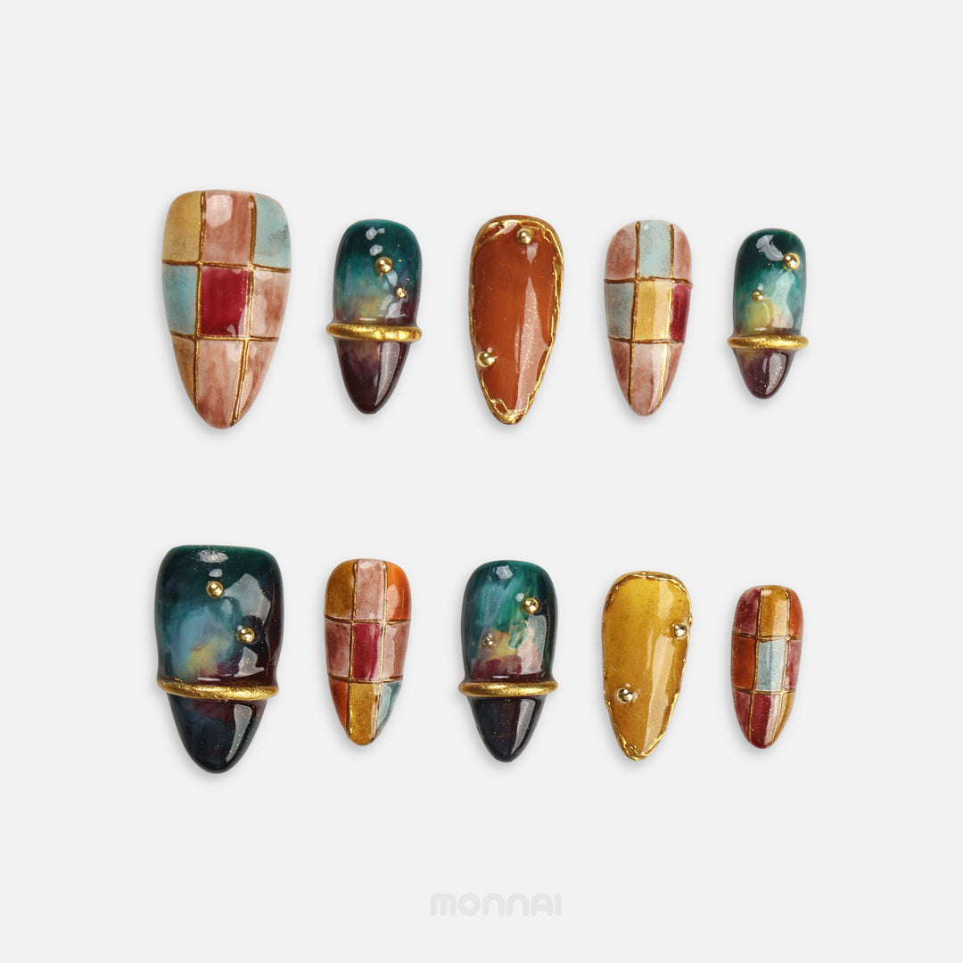 Amber Mosaic fall press on nails with stained glass patchwork and gold details