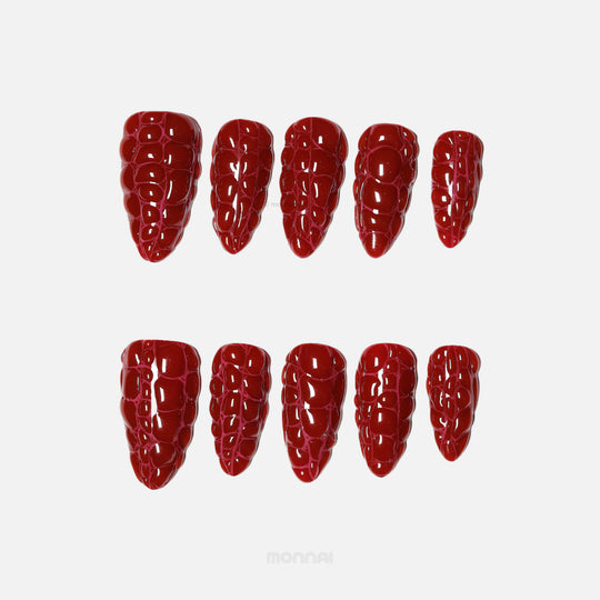 Antique Elegance press-on nails in rich dark red crocodile texture, shown in a set of glossy close-up nail tips.