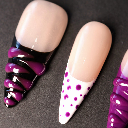 Berry Spin press-on nails laid out, featuring nude bases with black French tips, purple polka dots, and 3D gel swirls.