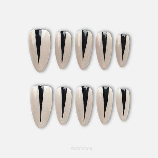 Black Dagger press on nails set featuring tapered black stripes on a creamy nude base.