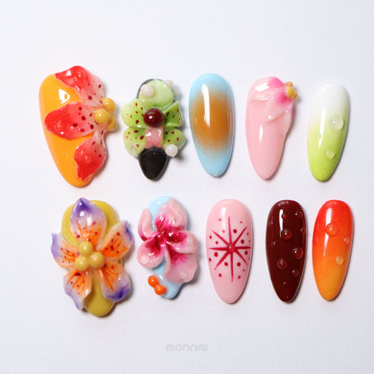 Blooming Paradise press-on nails laid out in bright airbrush colors with 3D floral details, glossy dewdrops, and retro stars