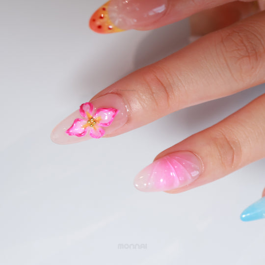 Blossom Breeze press-on nails worn on hand with pink 3D flower, pearls and pink-blue glossy tips
