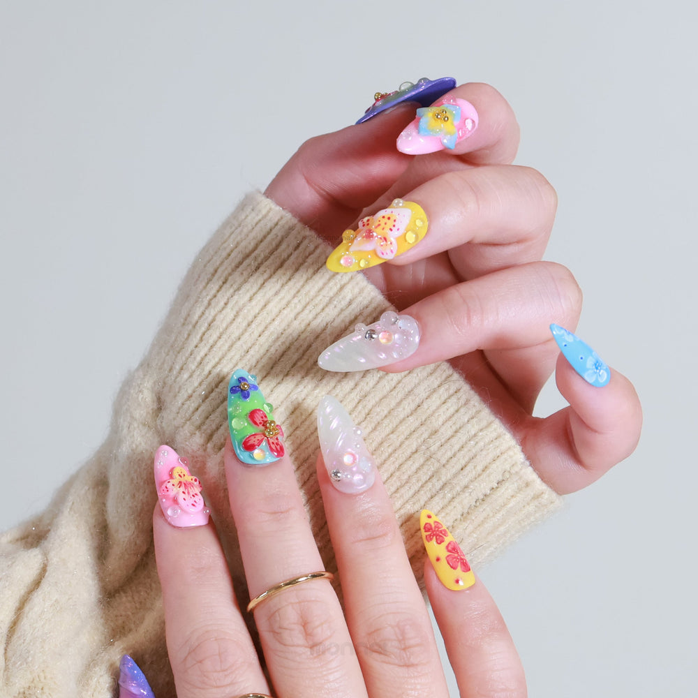 Blossom Fantasy press-on nails on hand, pastel multi-color floral art with 3D flowers and pearl dewdrops