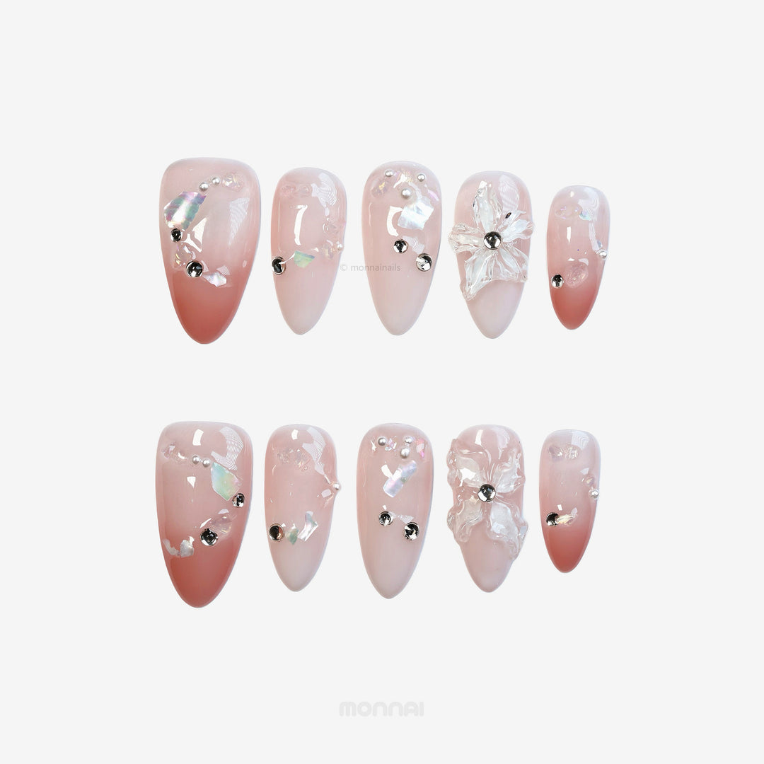 Blushing Petals press-on nails laid out with sheer blush gradient, 3D white flowers, and pearl accents.