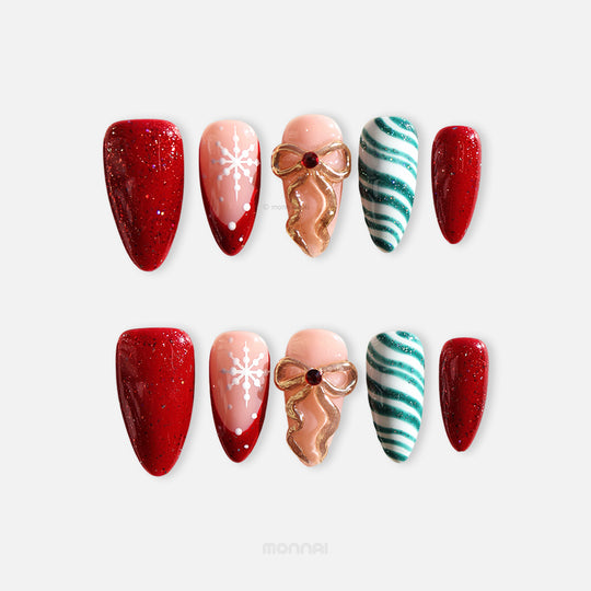 Candy Ribbon press-on nails laid out in red glitter, snowflake, gold bow, and teal striped designs
