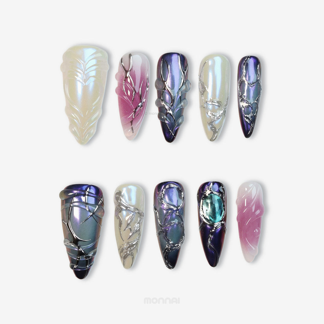 Celestial Aurora press-on nails set shown laid out, with iridescent white, violet-blue and soft pink sculpted chrome details.