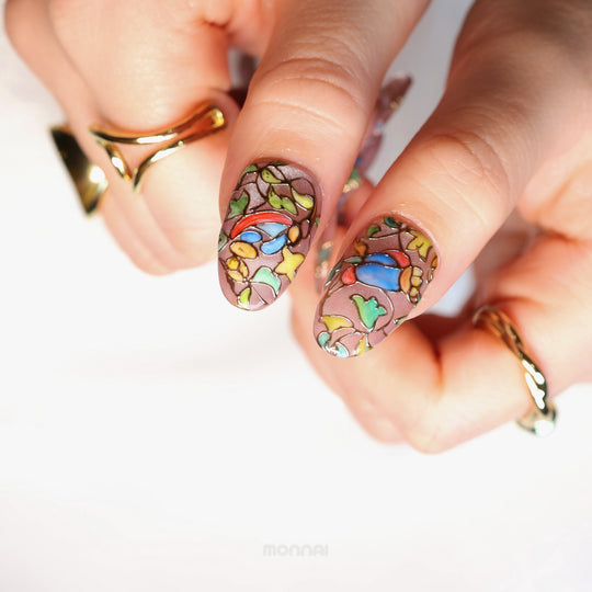 Chapel Garden press-on nails in close-up, showing jeweled mosaic floral stained-glass details