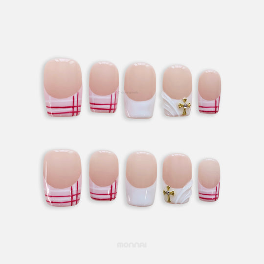Cherry Check press-on nails shown laid out, featuring preppy plaid tips, a 3D white wave accent, and a gold cross charm.