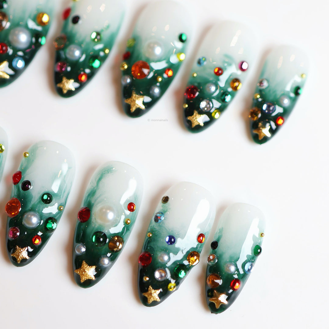Christmas Tree press-on nails with emerald green gradient, multicolored rhinestones, pearls, and gold star charms