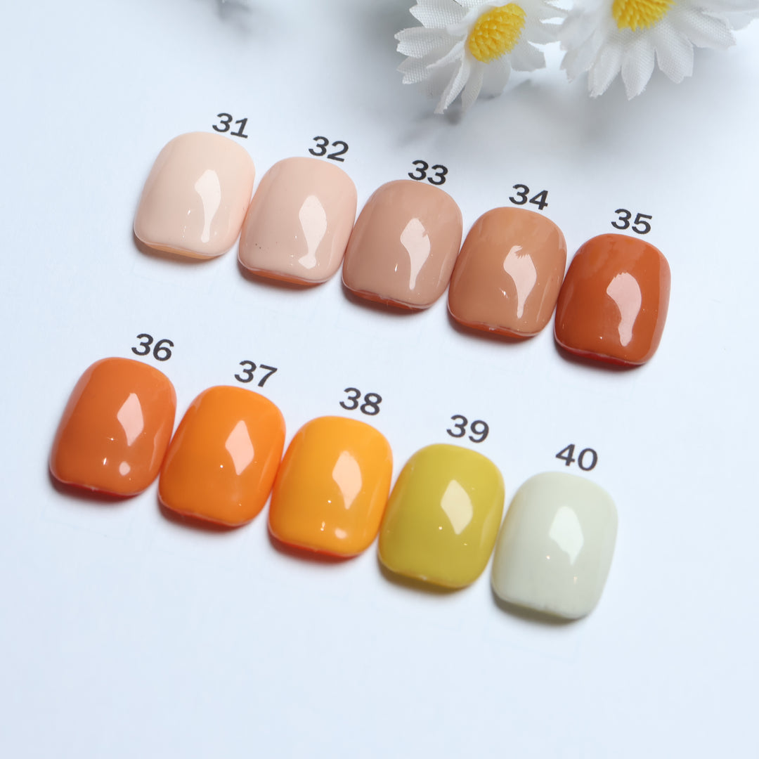 Classic Solid  • 60 Colors Available press-on nails shown in close-up, with glossy solid shades 31-40 arranged in rows.
