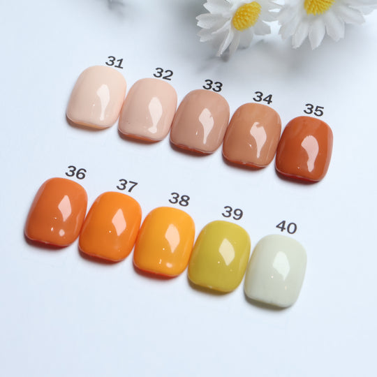 Classic Solid  • 60 Colors Available press-on nails shown in close-up, with glossy solid shades 31-40 arranged in rows.
