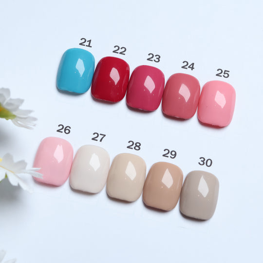 Classic Solid  • 60 Colors Available press-on nails laid out in blue, red, pink, and neutral shades