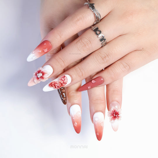 Crimson Bloom press-on nails worn on hand, darkly romantic blood-red ombre with 3D flowers and water-drop accents