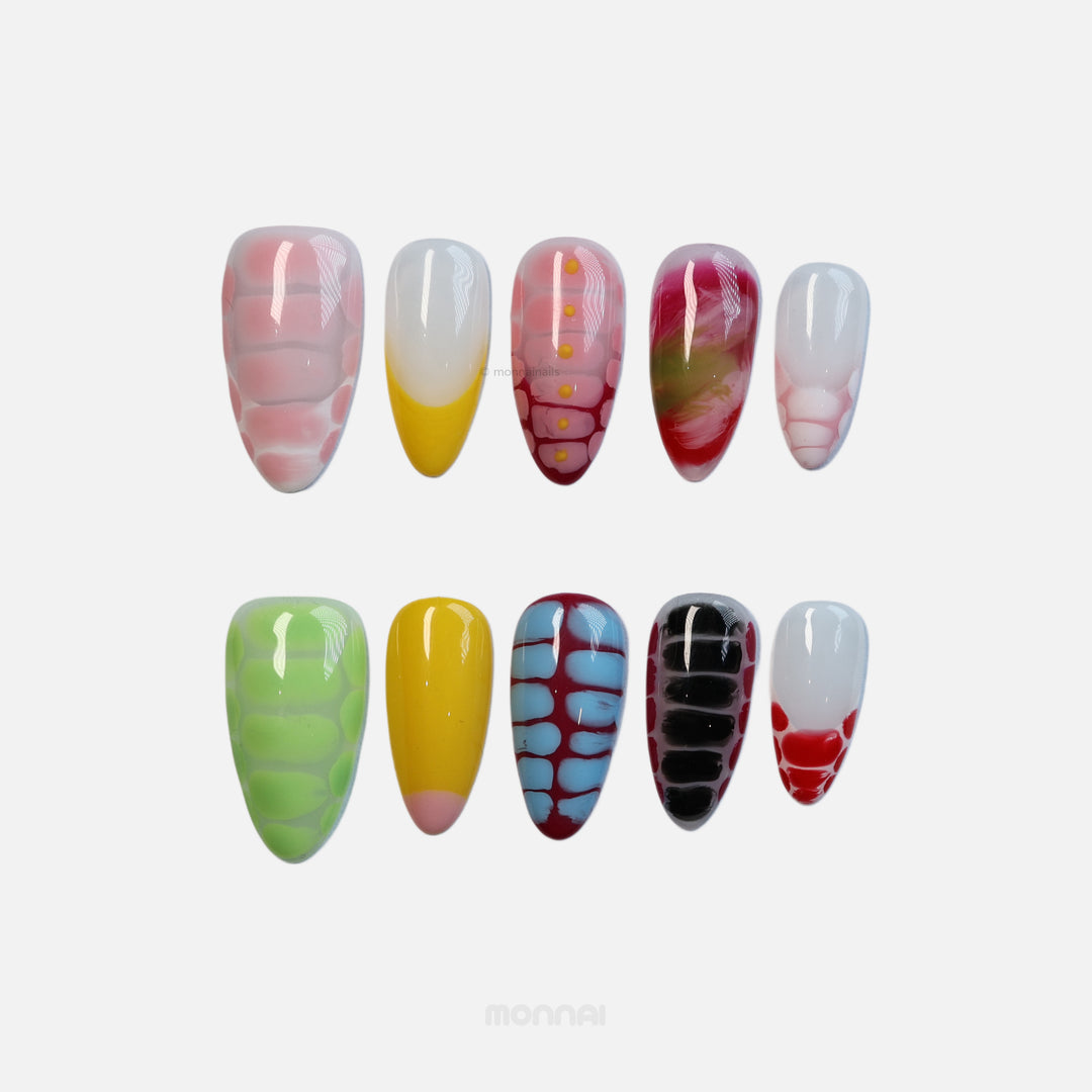 Croc Charm press-on nails set in bold croc texture with bright contrasting colors, laid out in two rows