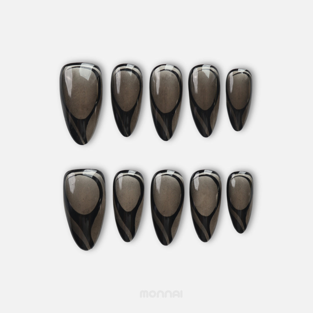 Dark Current press on nails with sheer smoky gray base and glossy black abstract curves
