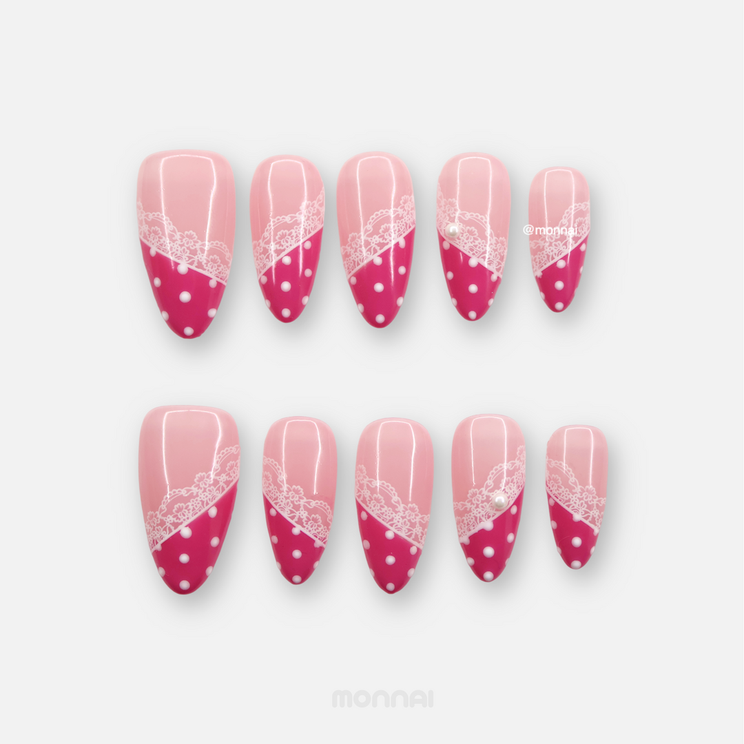 Dot & Lace press-on nails set with pink base, magenta tips, white lace, and polka dots