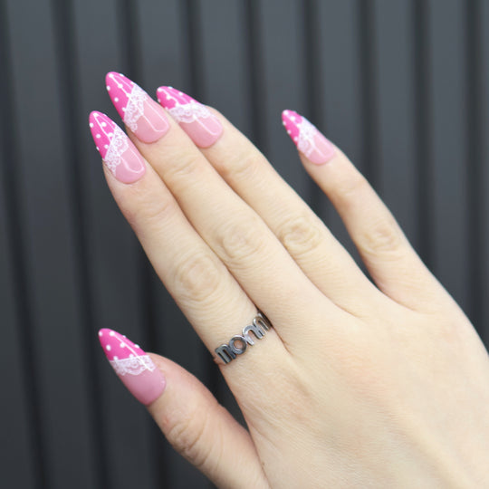 Dot &amp; Lace press-on nails on hand, soft pink with magenta tips, white lace and polka dots