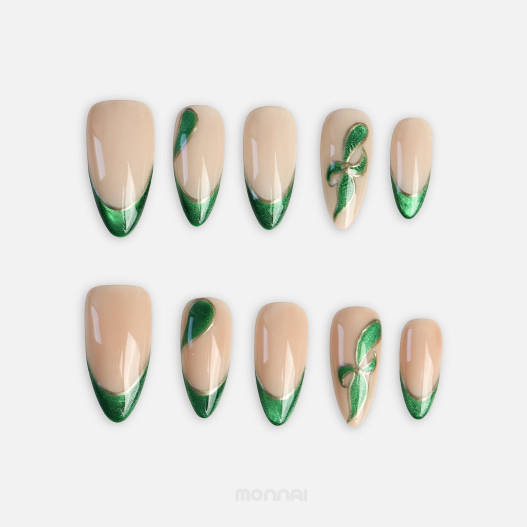 Emerald Ribbon green press on nails with cat eye French tips and green bows