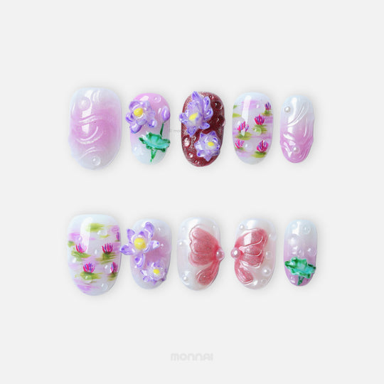 Fairy Pond press-on nails laid out in a dreamy pastel set with lotus, water lily and glossy droplet details