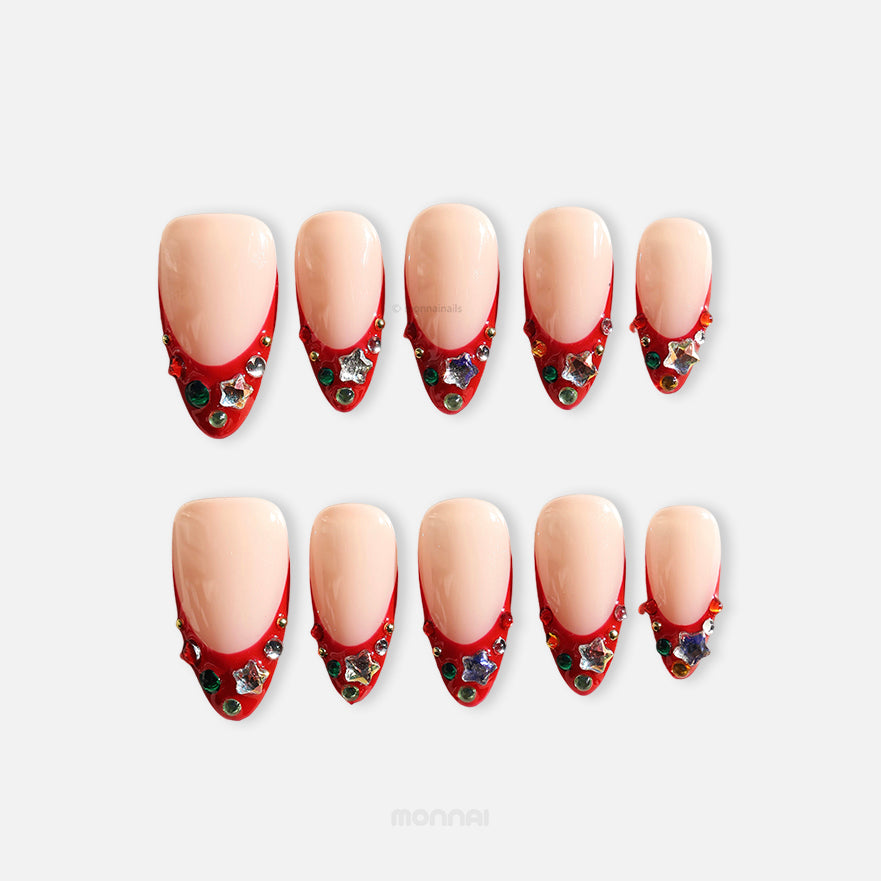Festive Jewels press-on nails set with nude base, red French tips, crystal stars and colorful jewels