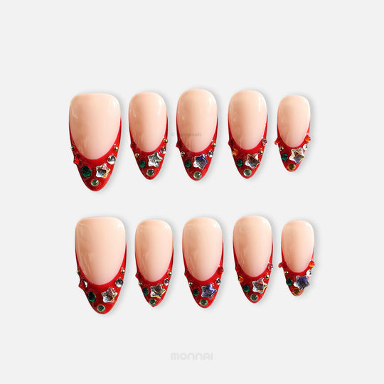Festive Jewels press-on nails set with nude base, red French tips, crystal stars and colorful jewels