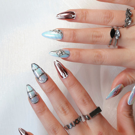 Flame Gradient press-on nails worn on hands, with icy blue chrome accents and flame-inspired glossy detailing.