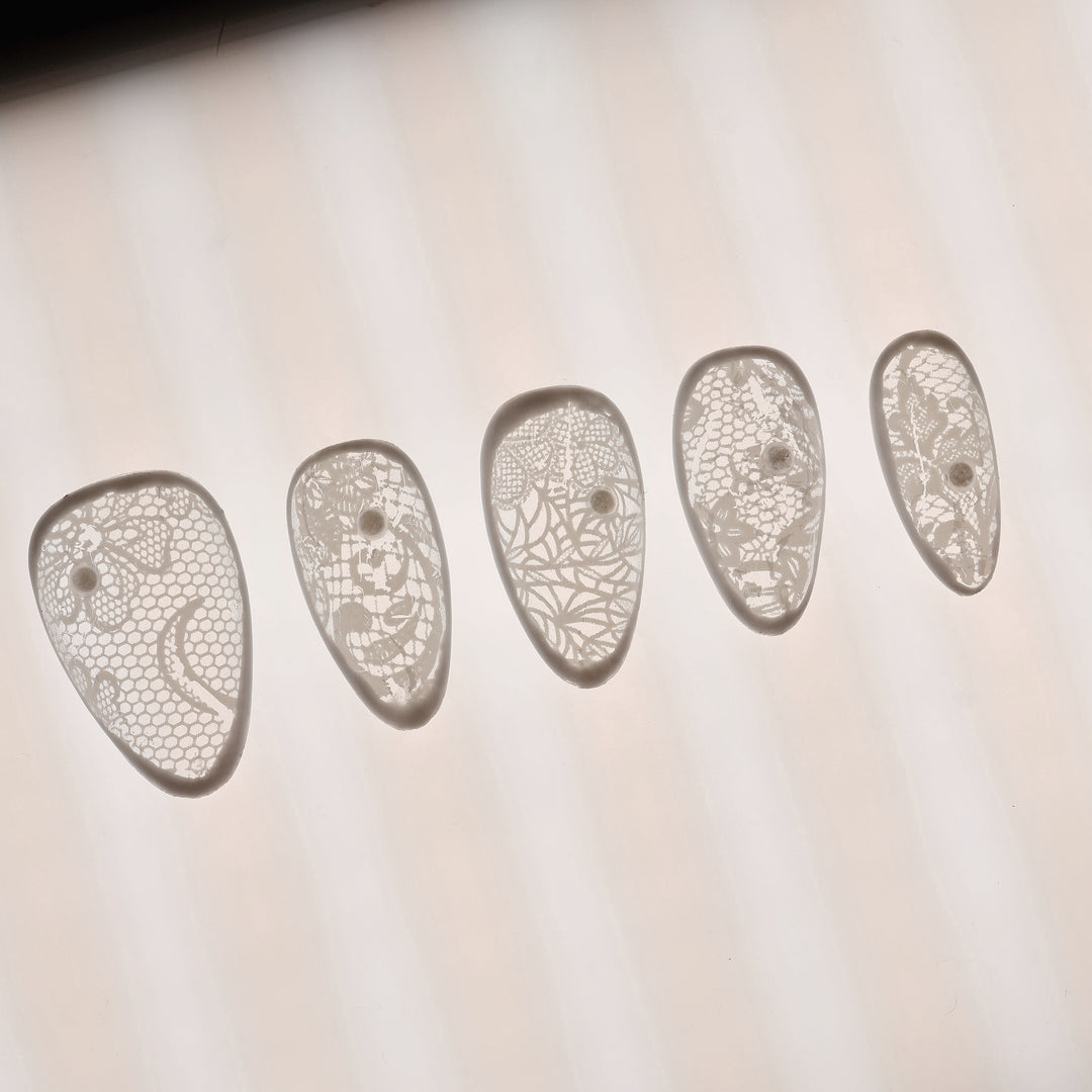 Floral Veil press-on nails in close-up, sheer white vintage lace pattern with micro pearls