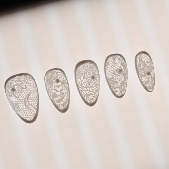 Floral Veil press-on nails in close-up, sheer white vintage lace pattern with micro pearls