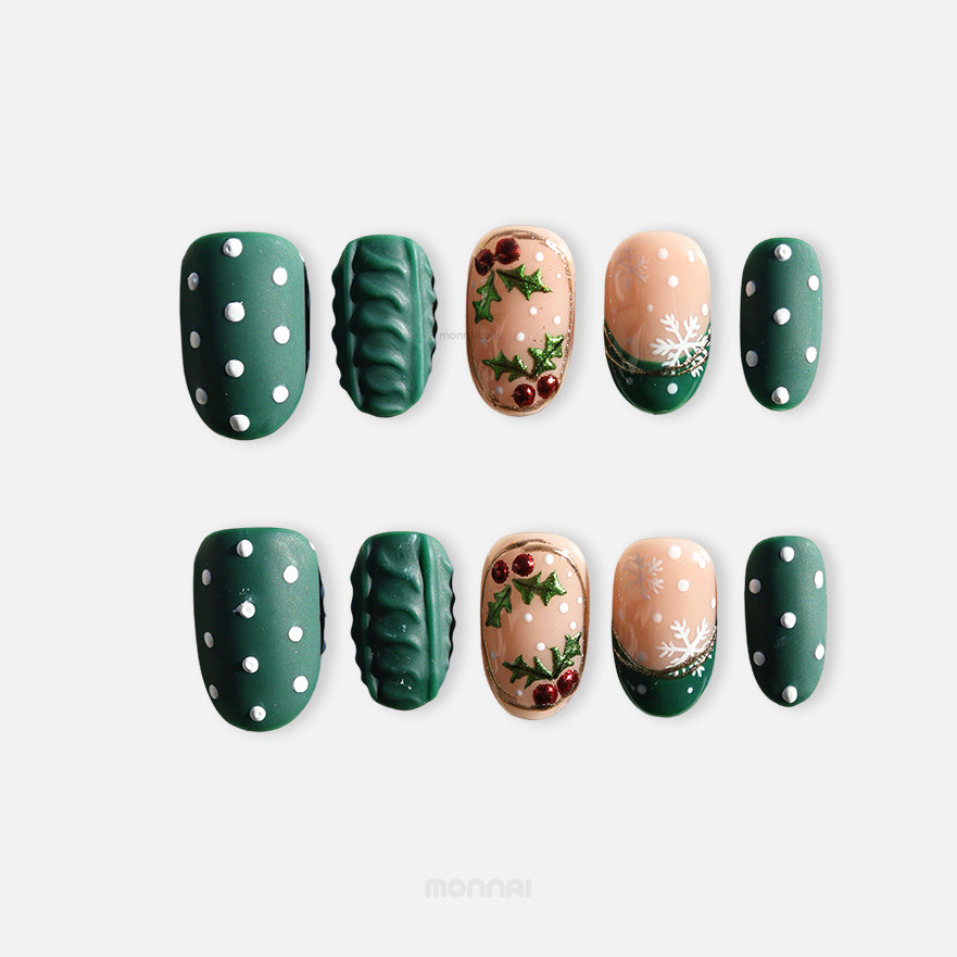 Forest Dots press-on nails set laid out with green polka dot nails, cable knit texture, and nude holiday accents