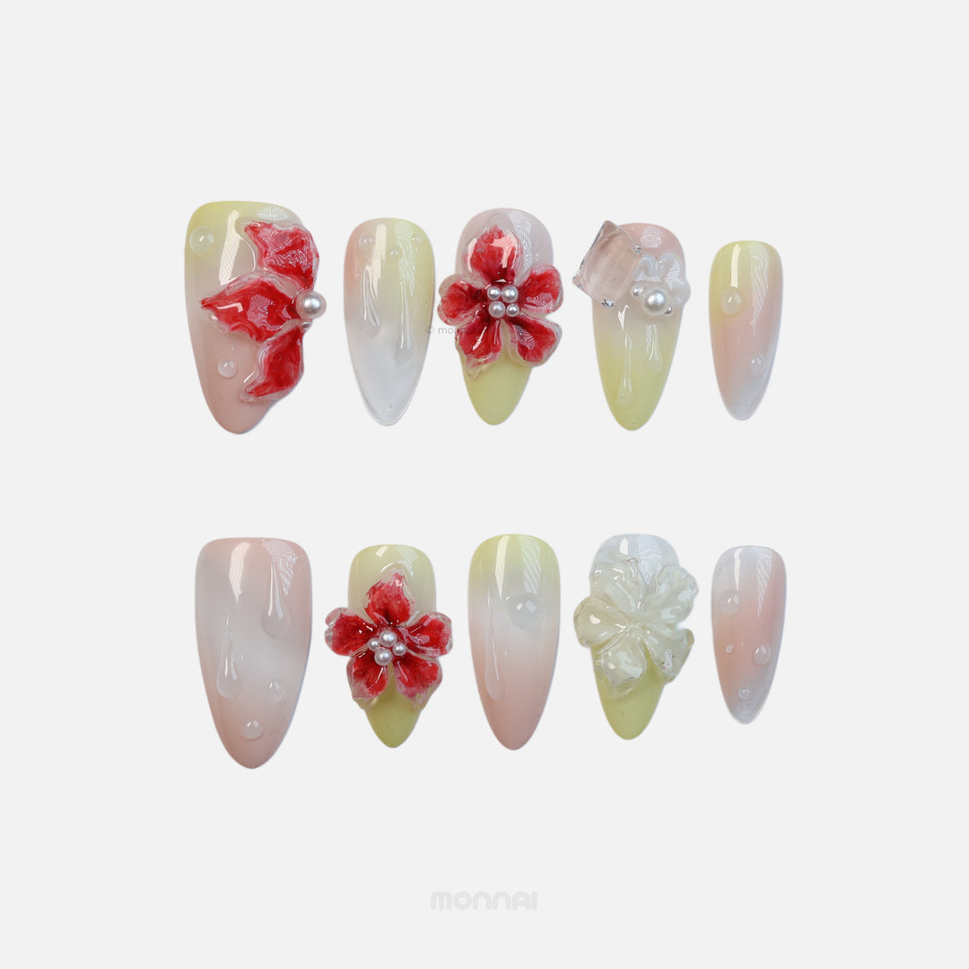 Frost Bloom press-on nails laid out, with glossy 3D florals, subtle gradients, and tiny bead details.