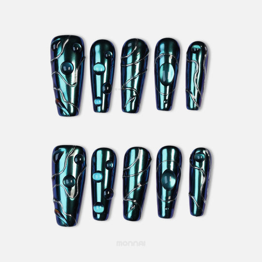 Galactic Shift press-on nails laid out in teal chrome with glossy raised details and metallic line accents