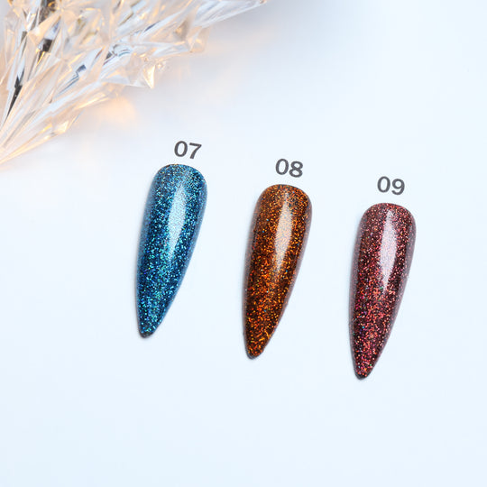 Glitter • 12 Colors Available press-on nails in blue, orange, and pink laid out in close-up