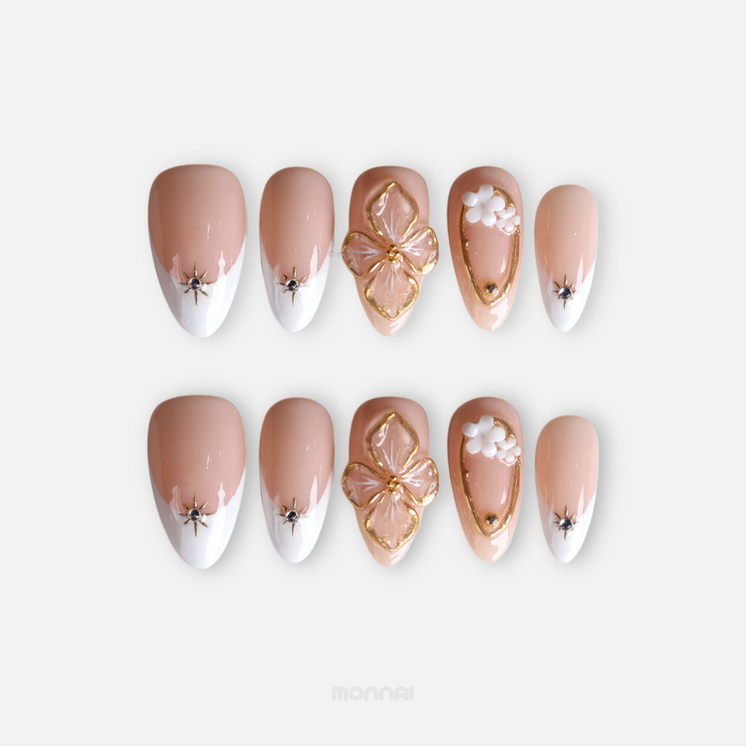 Golden Hour elegant bridal press-on nails with nude and white French tips, gold floral accents, and rhinestone stars