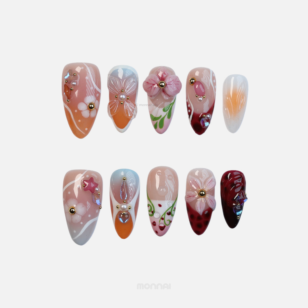 Grace vintage floral press-on nails with nude, pink, orange and deep red gradients, pearls, gems, and hand-painted flowers