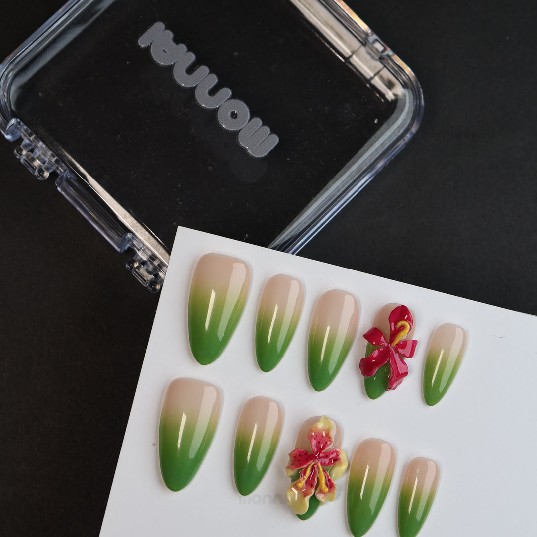 Green Sprout press-on nails shown laid out, with nude bases, green ombré tips, and 3D orchid details.