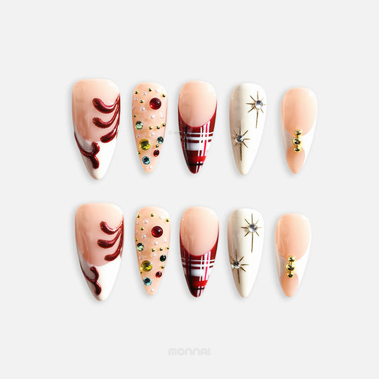Holiday Glam press-on nails full set with red tartan, rhinestones, gold starbursts, and nude glossy almond tips