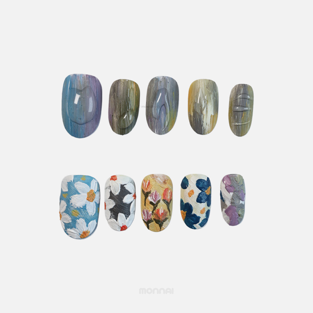 Impressionist Garden press-on nails laid out, showing textured matte floral brushstrokes and raised paint effects.