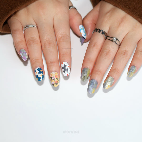 Impressionist Garden press-on nails shown on hands, with textured floral brushstrokes and matte canvas-like finish.