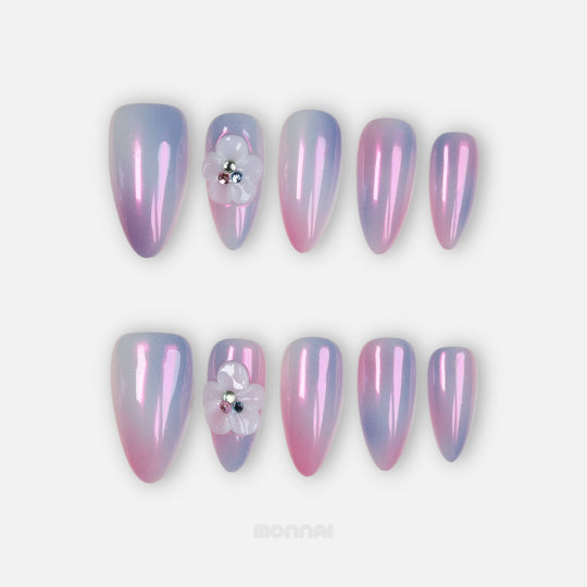 Lost in Petalight press-on nails in pink and lavender chrome, laid out with sculpted floral detail