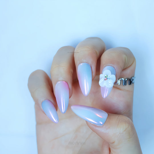 Lost in Petalight press-on nails worn on hand, soft chrome pink and lavender with a sculpted floral accent.