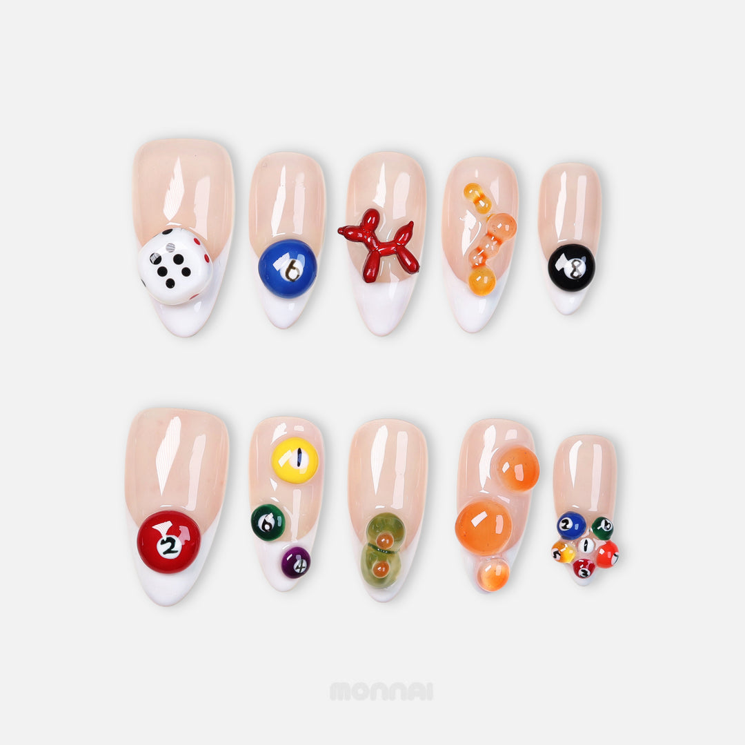 Lucky Numbers press-on nails with sheer nude French tips, billiard balls and dice in colorful Y2K game-inspired designs