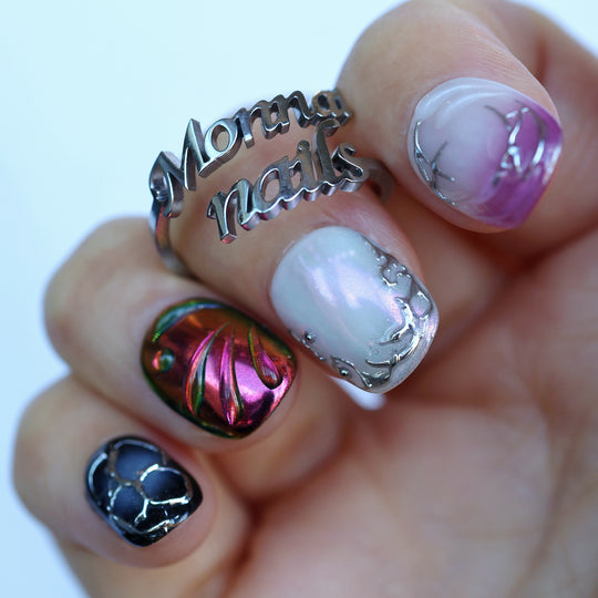 M-Code Cyber-Goth Rebellion press-on nails in close-up, with purple aura, chrome thorns and multichrome accents