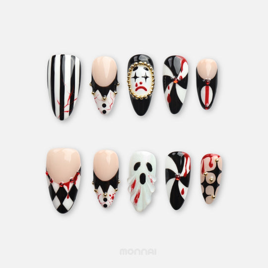 Midnight Marionette press on nails with gothic carnival clowns, black-white diamonds, gold beads and red horror accents