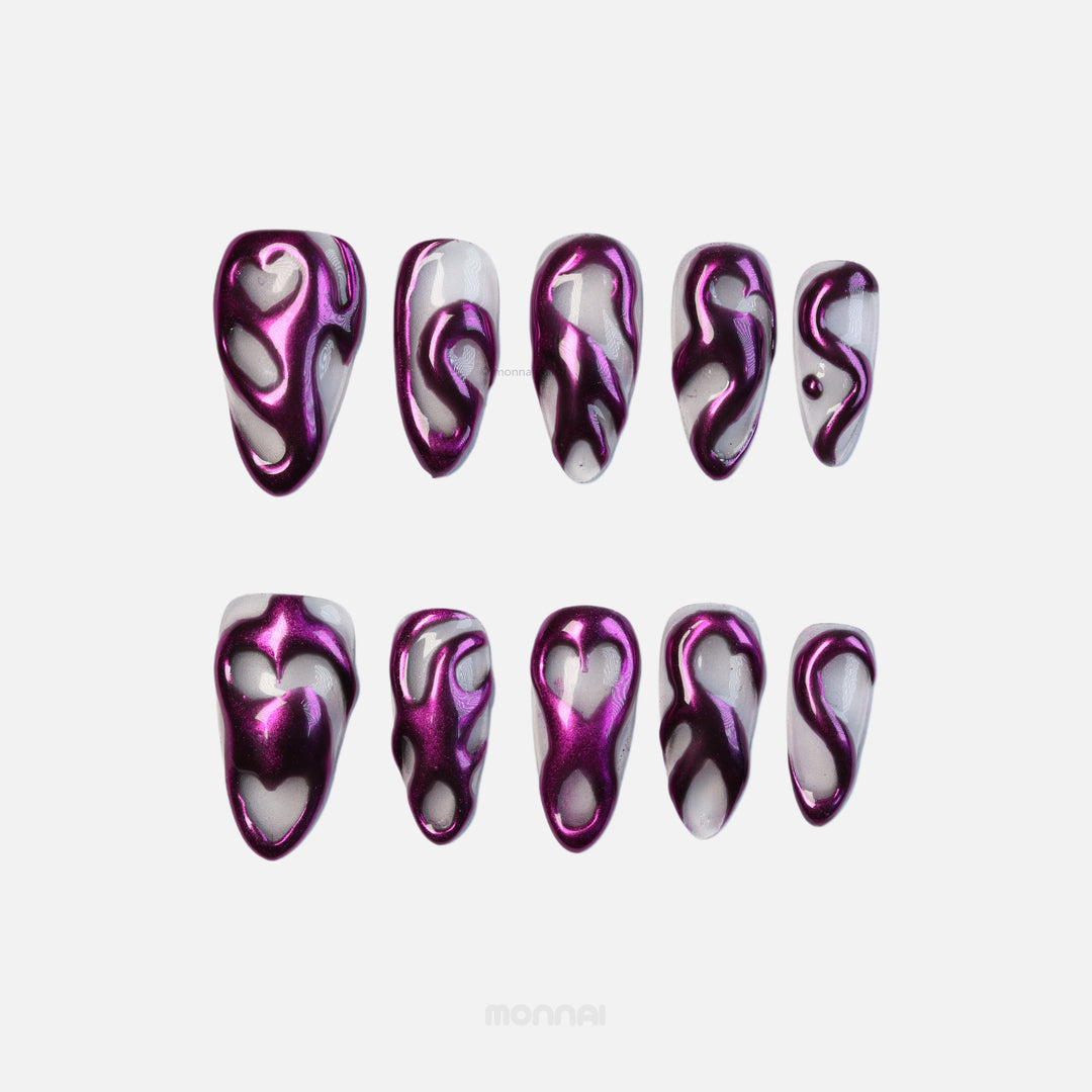 Mystic Flow press-on nails with metallic purple chrome swirls and heart motifs, shown laid out in two rows.