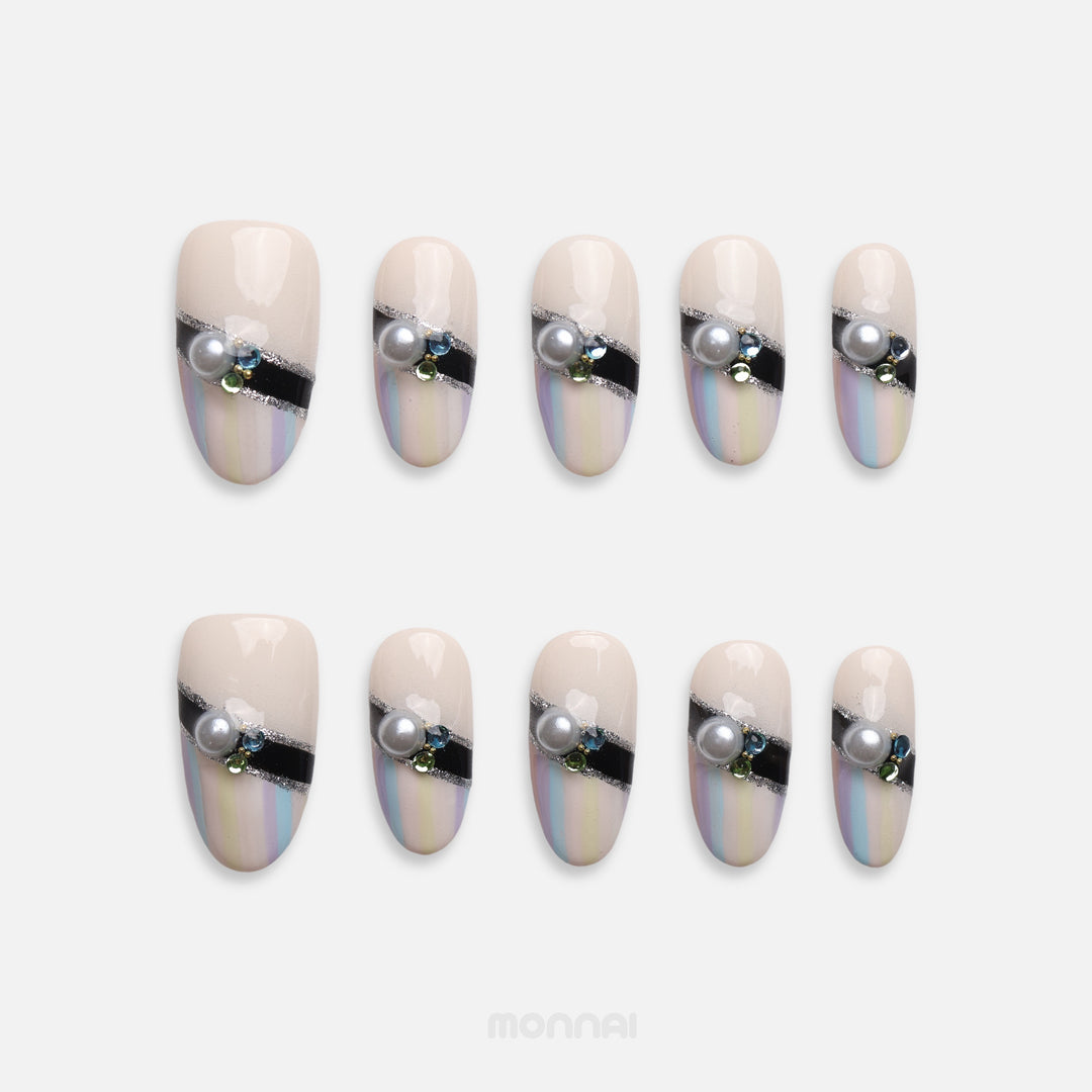 Pastel Couture pearl press on nails with pastel stripes, black band and gems