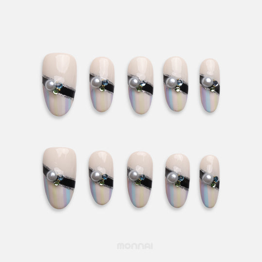 Pastel Couture pearl press on nails with pastel stripes, black band and gems