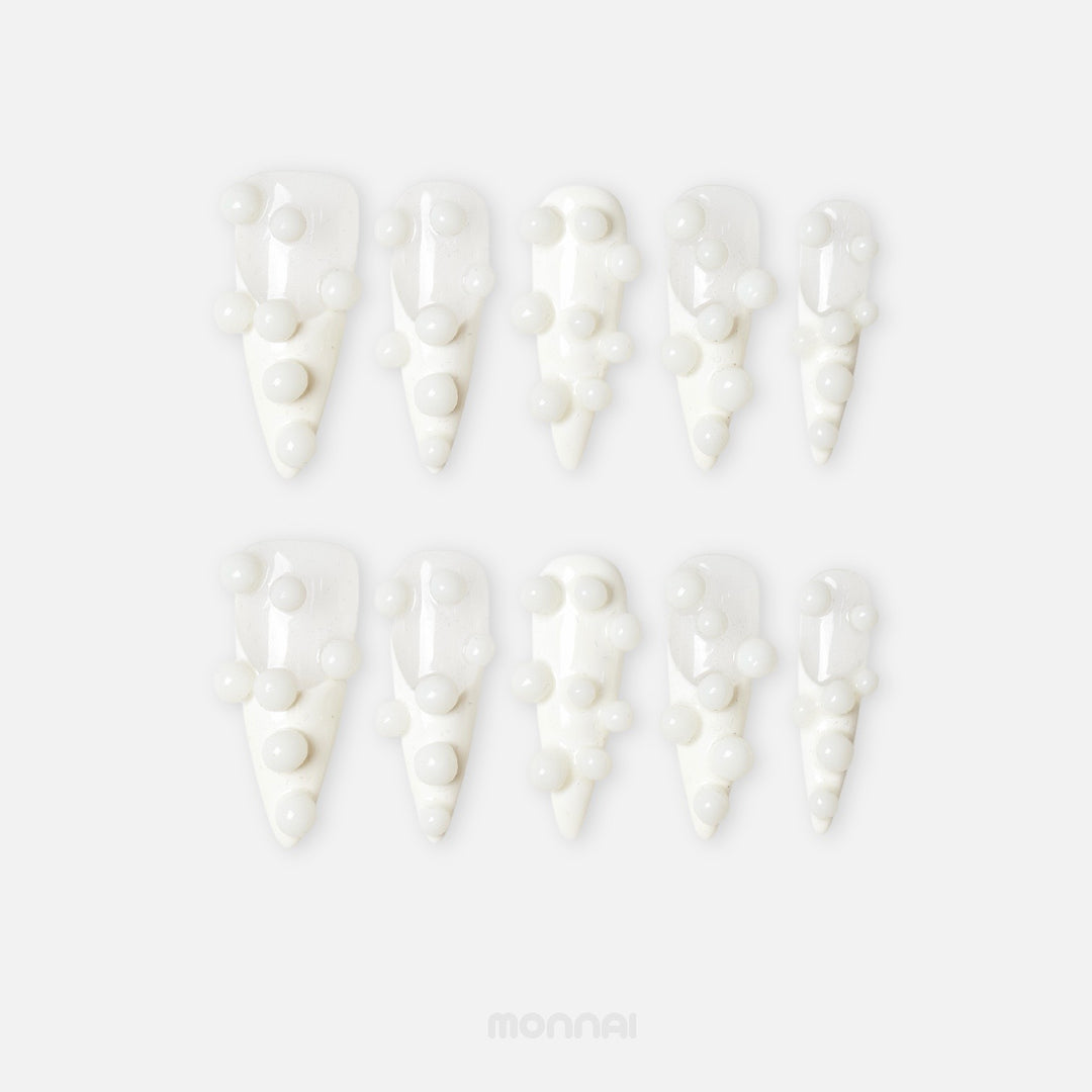 Pearl Bubbles press-on nails with white 3D bubble accents, laid out in a clean close-up.