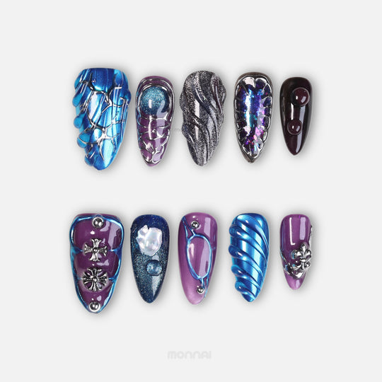 Prometheus press-on nails laid out in a bold futuristic style with metallic blue chrome and sculpted 3D textures