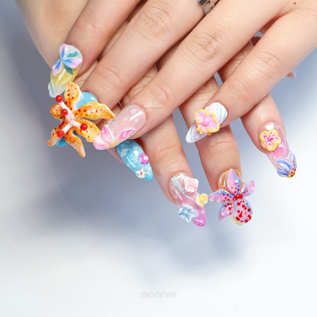 Radiant Bloom press-on nails worn on hands, with oversized 3D flowers and glossy dreamy candy-like pastel details.