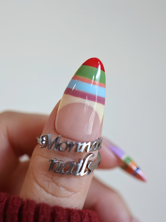 Rainbow Stripes press-on nails on hand, glossy nude base with colorful horizontal stripes and pointed shape